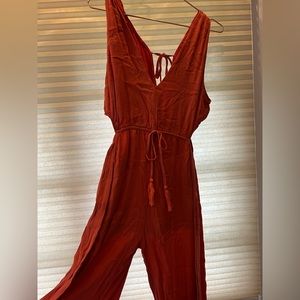 Orange Mahina jumpsuit with cutouts